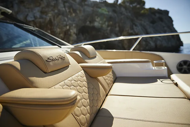 Detail of the yacht's teak deck and white upholstery