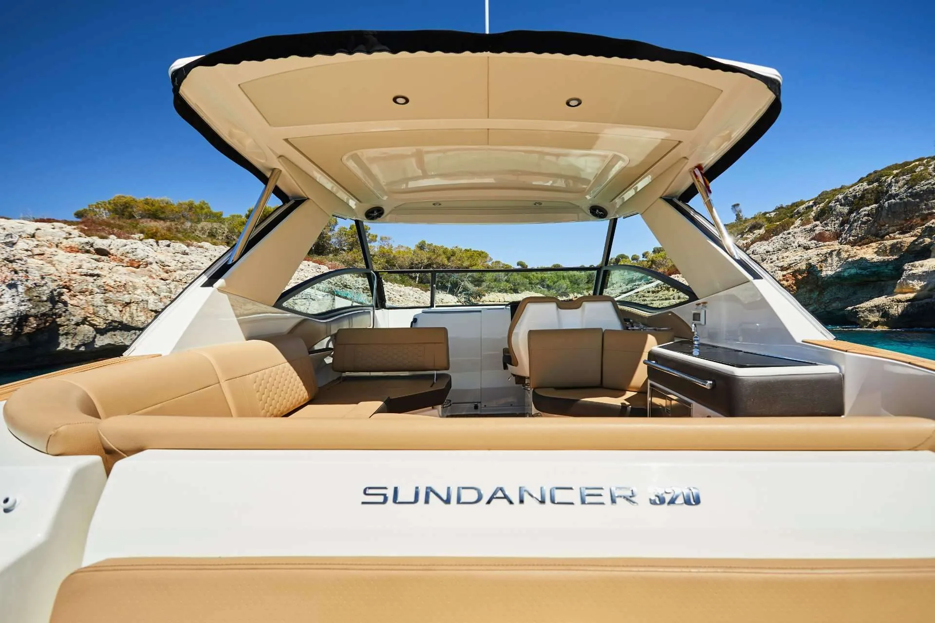 The Sea Ray Sundancer 320 at anchor in a quiet Costa Blanca cove