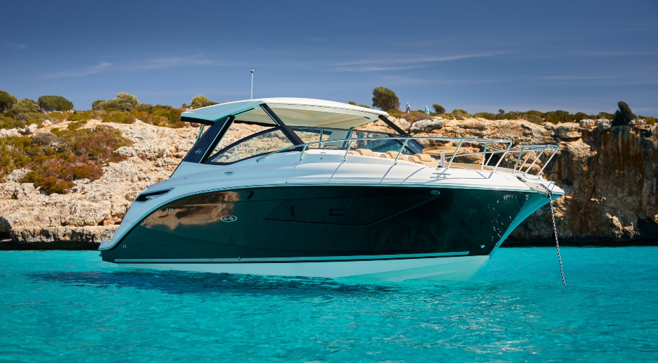 Sea Ray Sundancer 320 anchored in turquoise water