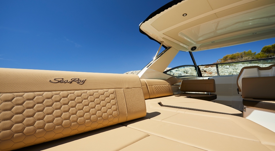 Champagne flutes on the teak deck of the yacht in golden hour light