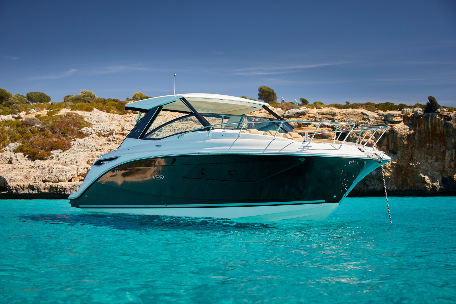 Sea Ray Sundancer 320 anchored in clear turquoise water